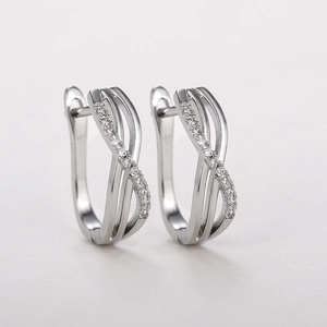 Silver interlocking twisted hoop earrings with shimmering pavé micro-zirconia details