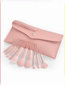 Detail of 10pcs peach pink makeup brushes with gradient bristles and a matching leather pouch