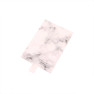 Pink marble paper ring display card with elegant golden slogan on white background