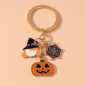 Detail of Halloween keychain with pumpkin, witch hat and spider web enamel charms