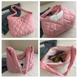 Detailed interior views showing large capacity and quilted texture of pink tote bag