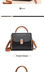 Front view of black crossbody bag with snake-embossed flap and orange handle details