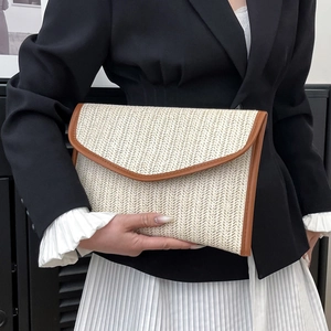 Fashionable woven straw envelope clutch bag with colorful stripes and contrast trim