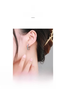 Close-up of S925 sterling silver hoop earring with blue enamel line on female model