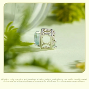 Macro detail of S925 silver unicorn heart charm with blue gemstone and hollow patterns