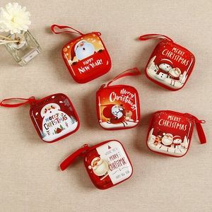 Set of six red Christmas themed square coin purses with cartoon Santa and reindeer motifs
