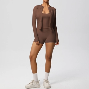Three-piece yoga set with brown long sleeve jacket, sports bra and high waist shorts