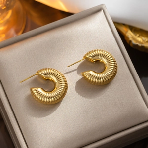 Vintage hollow textured gold-tone titanium steel C-shape earrings in a gift box