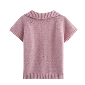 Back view of pink short-sleeved knit top showing ribbed texture and soft fabric details