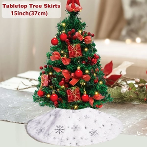 Close-up of 15-inch white plush tabletop Christmas tree skirt with silver snowflake pattern