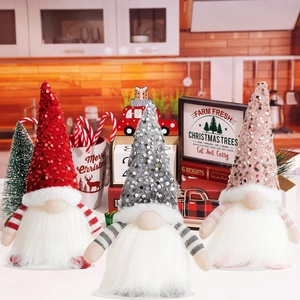 Three glowing Christmas gnomes with sequined hats in a cozy festive holiday setting
