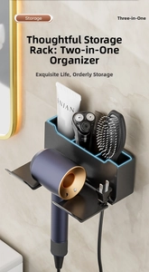Macro view of wall-mounted matte black hair dryer holder with shaver storage compartment
