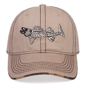 Close-up of beige distressed baseball cap with fishbone embroidery and camouflage brim