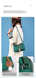 Dettagli della borsa a tracolla in nylon verde scuro con anelli argentati e tirazip in pelle
