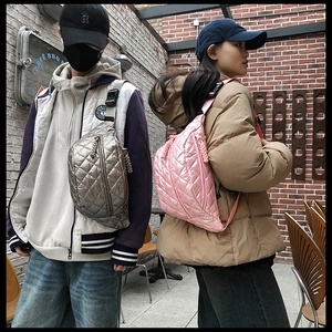 Quilted silver and pink crossbody bags shown in a trendy urban street style setting