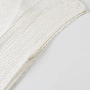 Detail of white ribbed knit fabric showing fine vertical texture and premium stitching