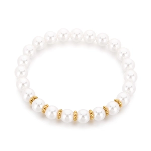 Stackable pearl bracelet with gold stainless steel beads on white background