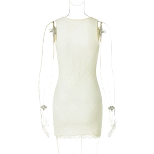 Detail of white lace texture on a backless sleeveless bodycon mini dress with scallop hem