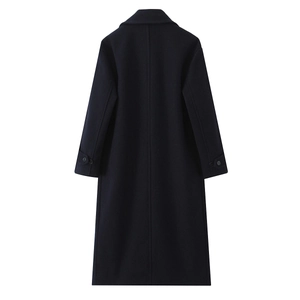 Detail view of the back tailoring and high-quality wool fabric of navy blue coat