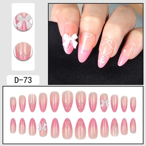 Pink gradient long stiletto press-on nails with white 3D bows and elegant pearl accents