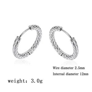 Detail of silver hoop earrings with hammered texture measuring 12mm in inner diameter