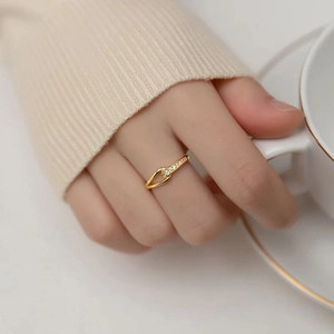 Elegant gold titanium steel ring with hollow long bar diamond design worn on hand