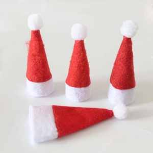 Set of four mini red and white non-woven Christmas hats for lollipops and holiday decor