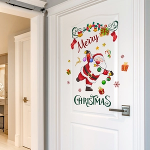 Merry Christmas festive wall stickers with Santa Claus and gifts on a white wooden door