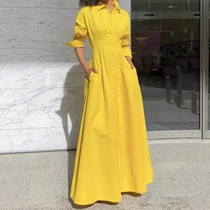 Detail of yellow long-sleeve maxi shirt dress with waist tie and functional side pockets