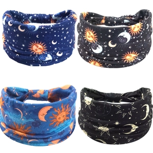Set of 4 celestial print wide headbands featuring sun, moon, and star patterns