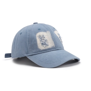 Vintage light blue washed denim baseball cap with distressed details and white patches