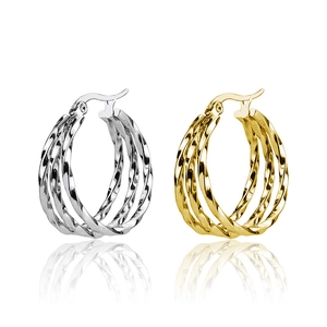 Fashion twisted rope hoop earrings in gold and silver steel finish shown on white background