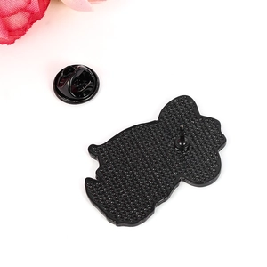 Detail view of the black metal cat brooch back featuring a secure rubber pin clutch