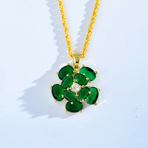 Gold-plated floral necklace with green malachite petals and a center sparkling crystal