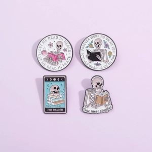 Gothic skull enamel pins set featuring a reading skeleton design with tarot card style