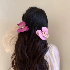 Realistic orchid flower hair clips with pearl centers in purple and pink tones