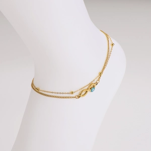 Golden double-layer anklet with infinity symbol and evil eye charm on foot model