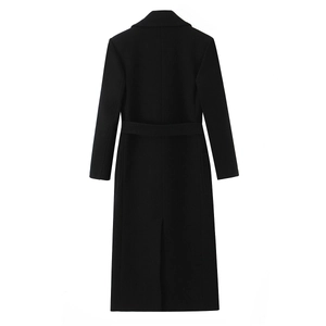 Women's minimalist long black wool coat featuring a slim fit tie-waist seen from the back