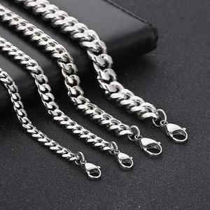 Detail view of silver stainless steel Cuban link chains in four different widths with lobster clasps