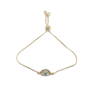 Bracelet ajustable en chaîne dorée avec pendentif œil bleu et détails en zircon