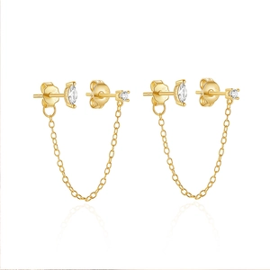 Detail of gold S925 silver chain earrings with marquise and round cubic zirconia stones