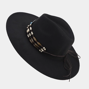 Detail of black wide brim felt jazz hat featuring ethnic style beaded tassel headband