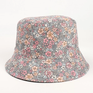 Detail of grey cotton bucket hat featuring delicate pink and orange floral print