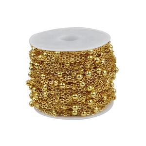 Macro shot of 10m gold-plated brass bead chain roll for DIY jewelry making accessories