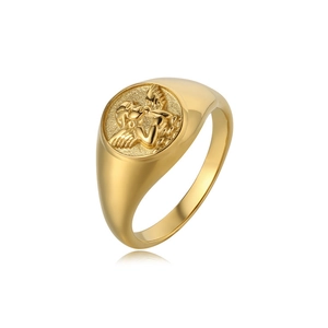 Close-up of golden Cupid angel relief on vintage stainless steel ring with polished finish