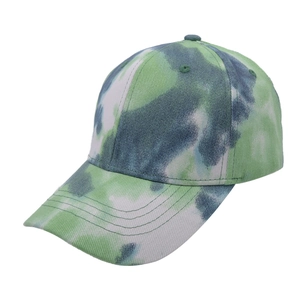 Detail view of tie-dye baseball cap with green grey white pattern and breathable eyelets