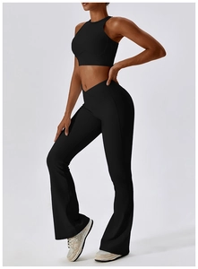 Close-up of black yoga set featuring V-shaped cross waist and ribbed texture fabric