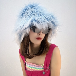 Close-up of fluffy light blue faux fur bucket hat with soft plush texture for winter style
