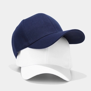 Classic plain navy blue and white cotton baseball caps in a minimalist six-panel design