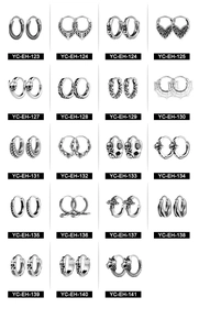 Detailed close-up of retro punk style skull and snake earrings in polished steel